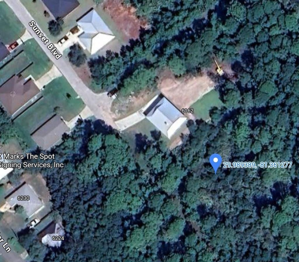 0 Sunset Street St. Augustine, FL 32095 - Photo 4 of 4 an aerial view of house with yard