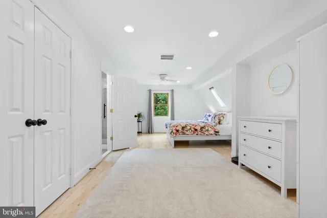 a view of bedroom with furniture and window