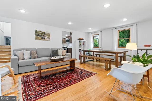 a living room with furniture and a rug