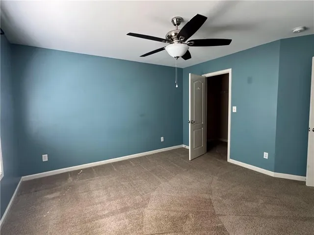 an empty room with closet area