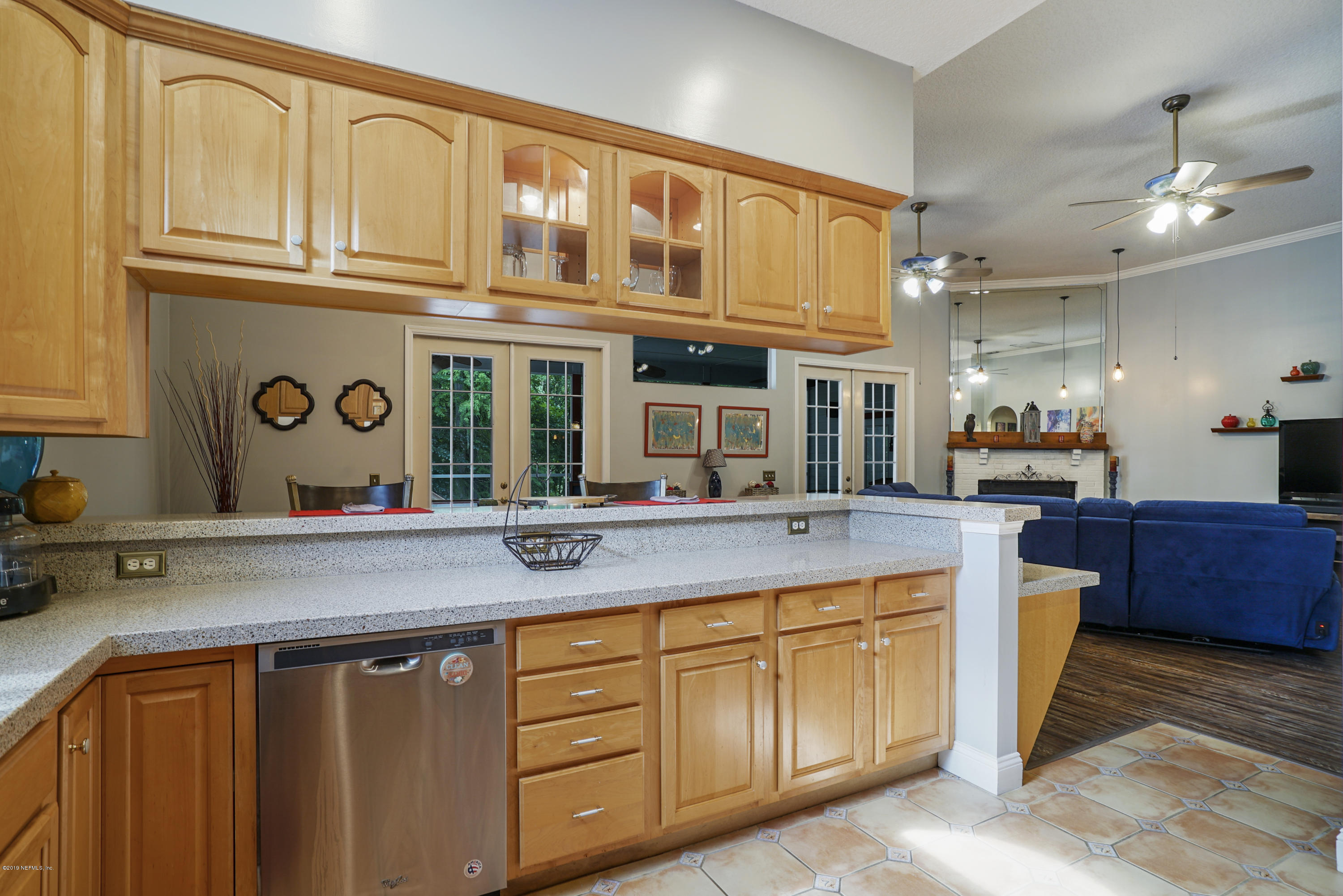 2066 Cornell Road Middleburg, FL 32068 - Photo 15 of 43 a kitchen with stainless steel appliances granite countertop a sink and cabinets