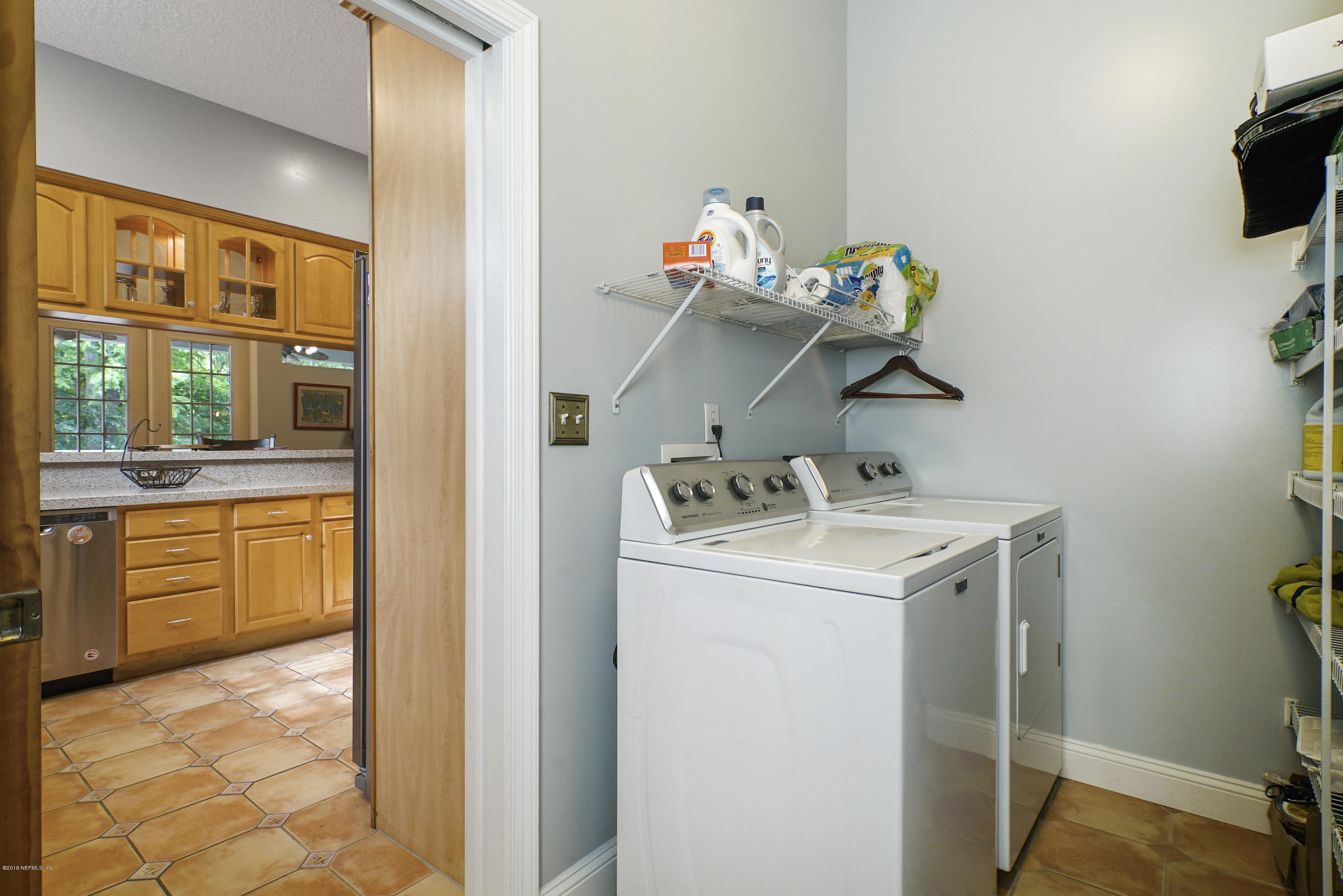 2066 Cornell Road Middleburg, FL 32068 - Photo 17 of 43 a utility room with dryer and washer