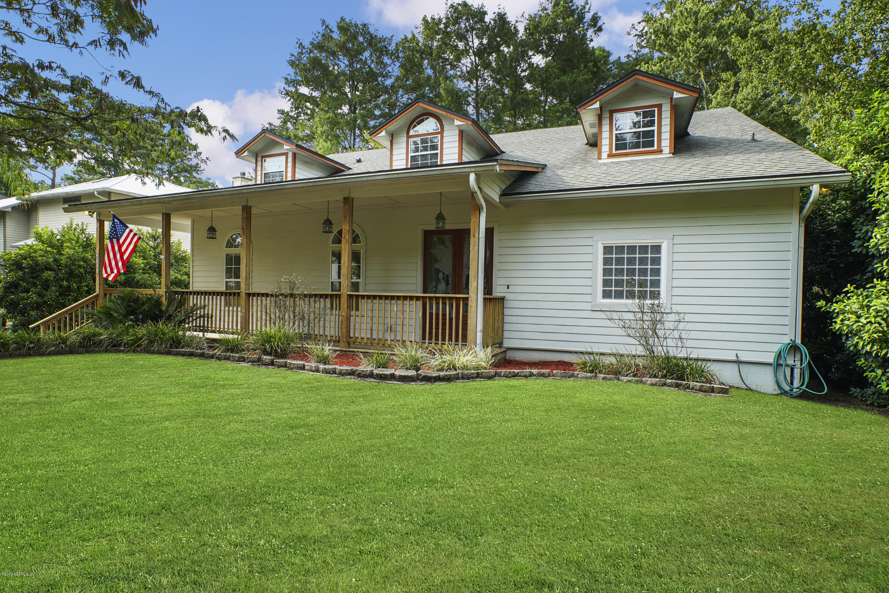 2066 Cornell Road Middleburg, FL 32068 - Photo 2 of 43 a front view of a house with a garden