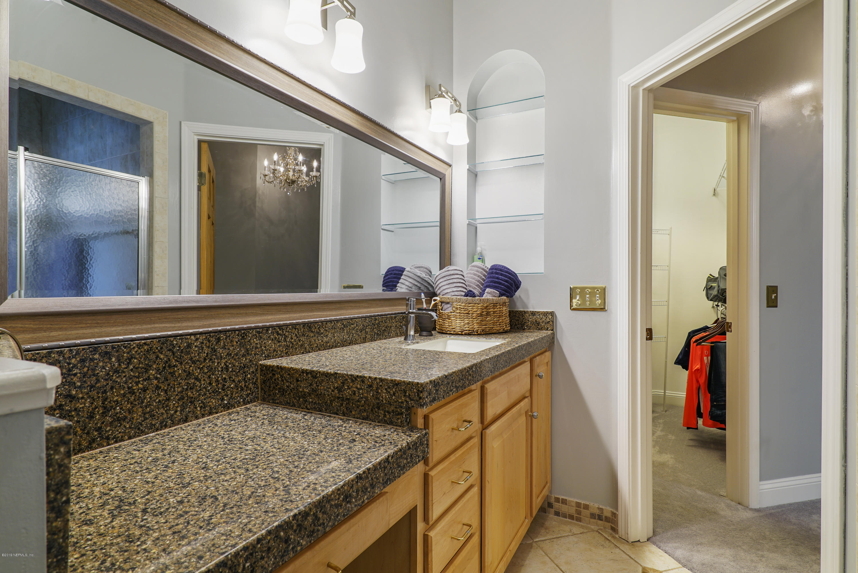 2066 Cornell Road Middleburg, FL 32068 - Photo 24 of 43 a bathroom with a granite countertop sink and a mirror
