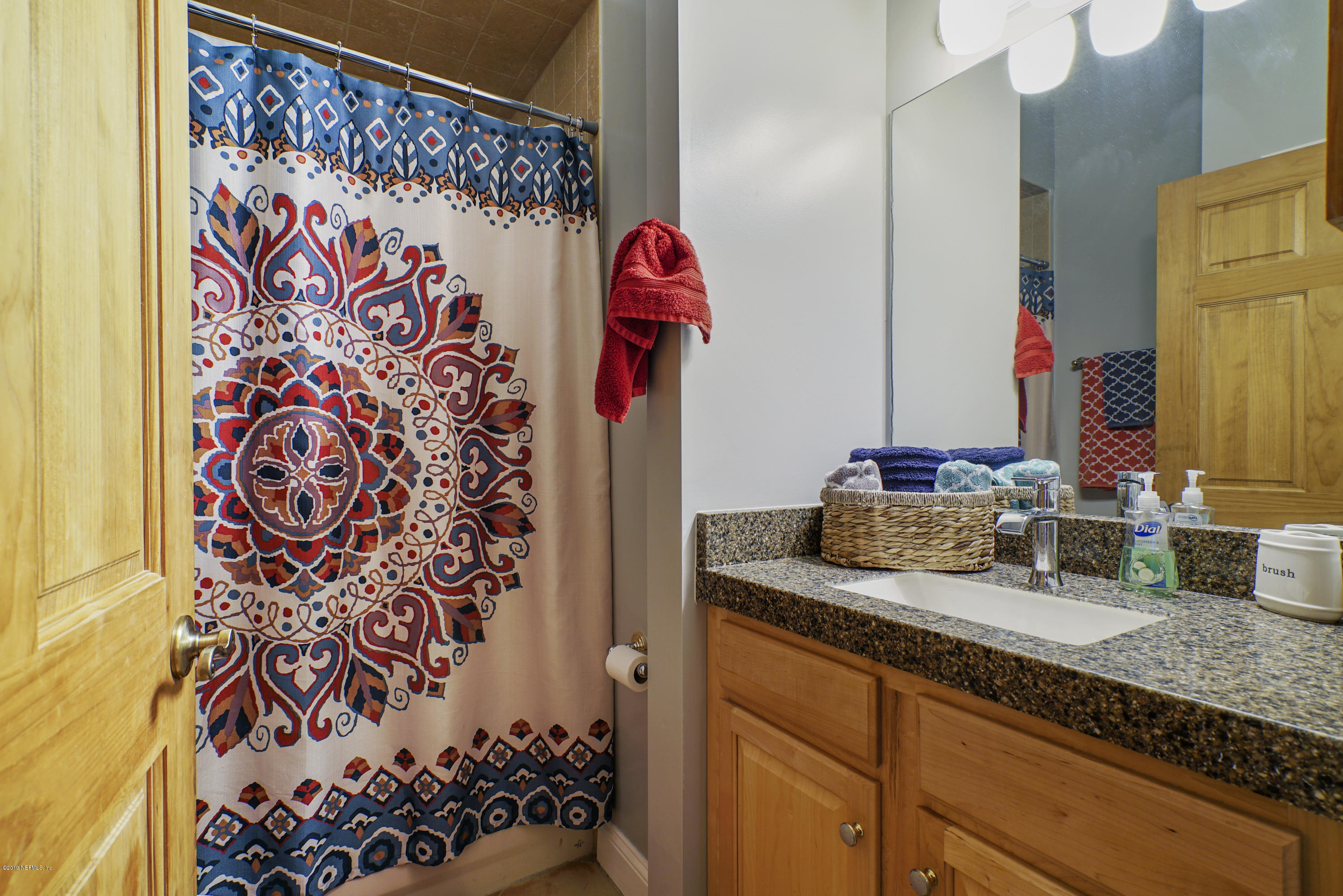 2066 Cornell Road Middleburg, FL 32068 - Photo 27 of 43 a bathroom with a granite countertop sink and a mirror