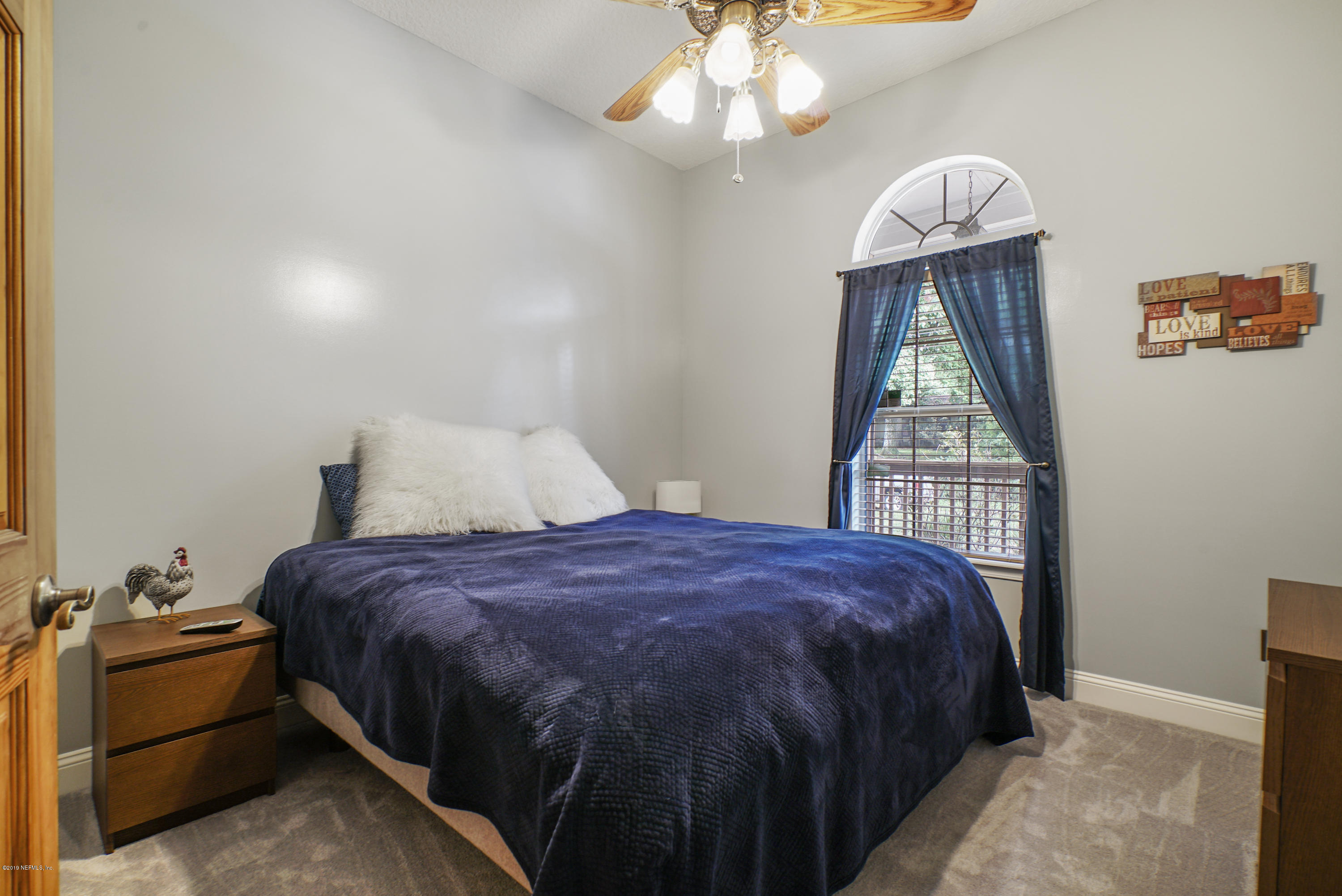 2066 Cornell Road Middleburg, FL 32068 - Photo 28 of 43 a bedroom with a bed and a window