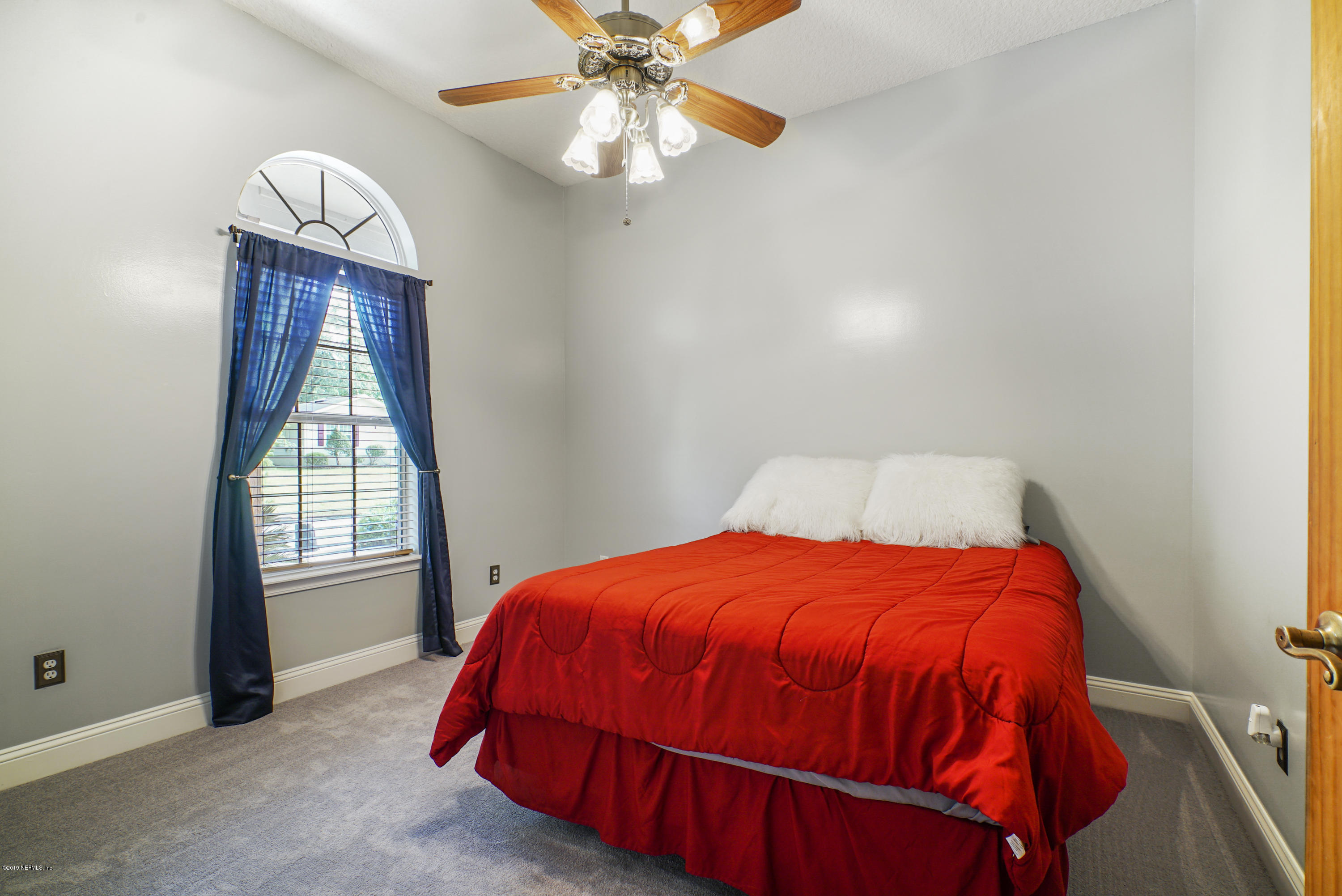 2066 Cornell Road Middleburg, FL 32068 - Photo 29 of 43 a bedroom with a bed and a window