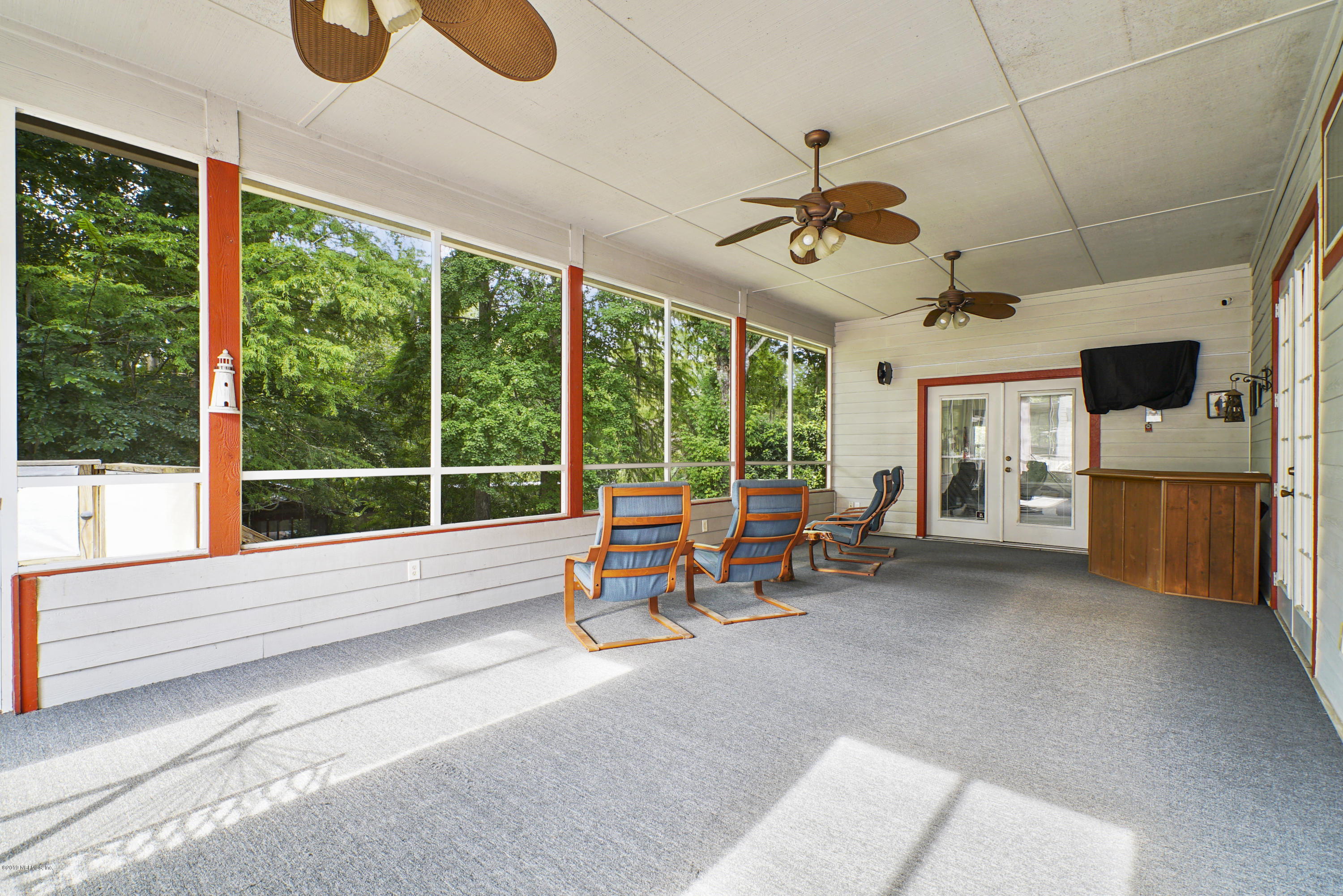 2066 Cornell Road Middleburg, FL 32068 - Photo 30 of 43 a view of a hall with furniture and large windows