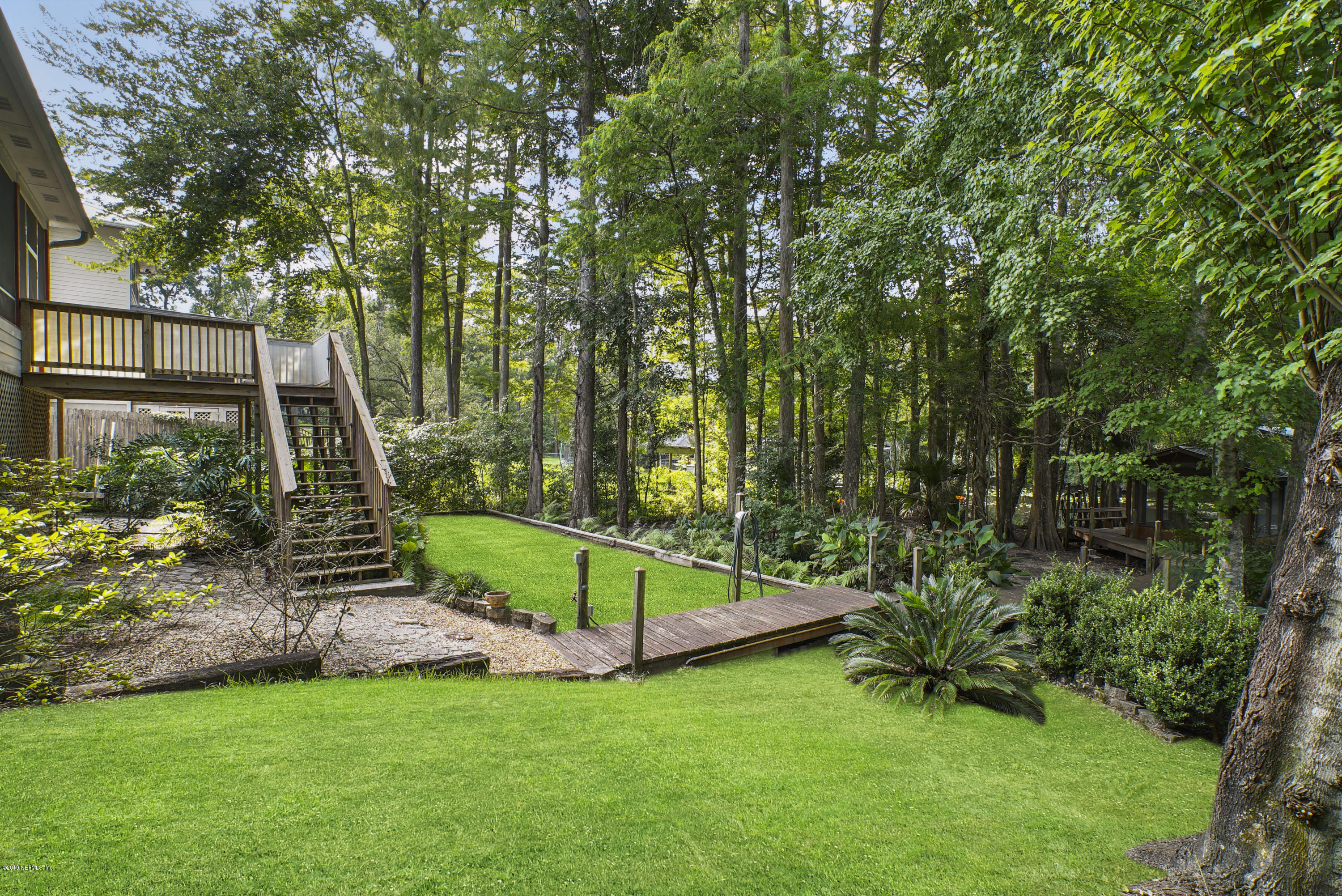2066 Cornell Road Middleburg, FL 32068 - Photo 34 of 43 a view of a backyard with a small cabin