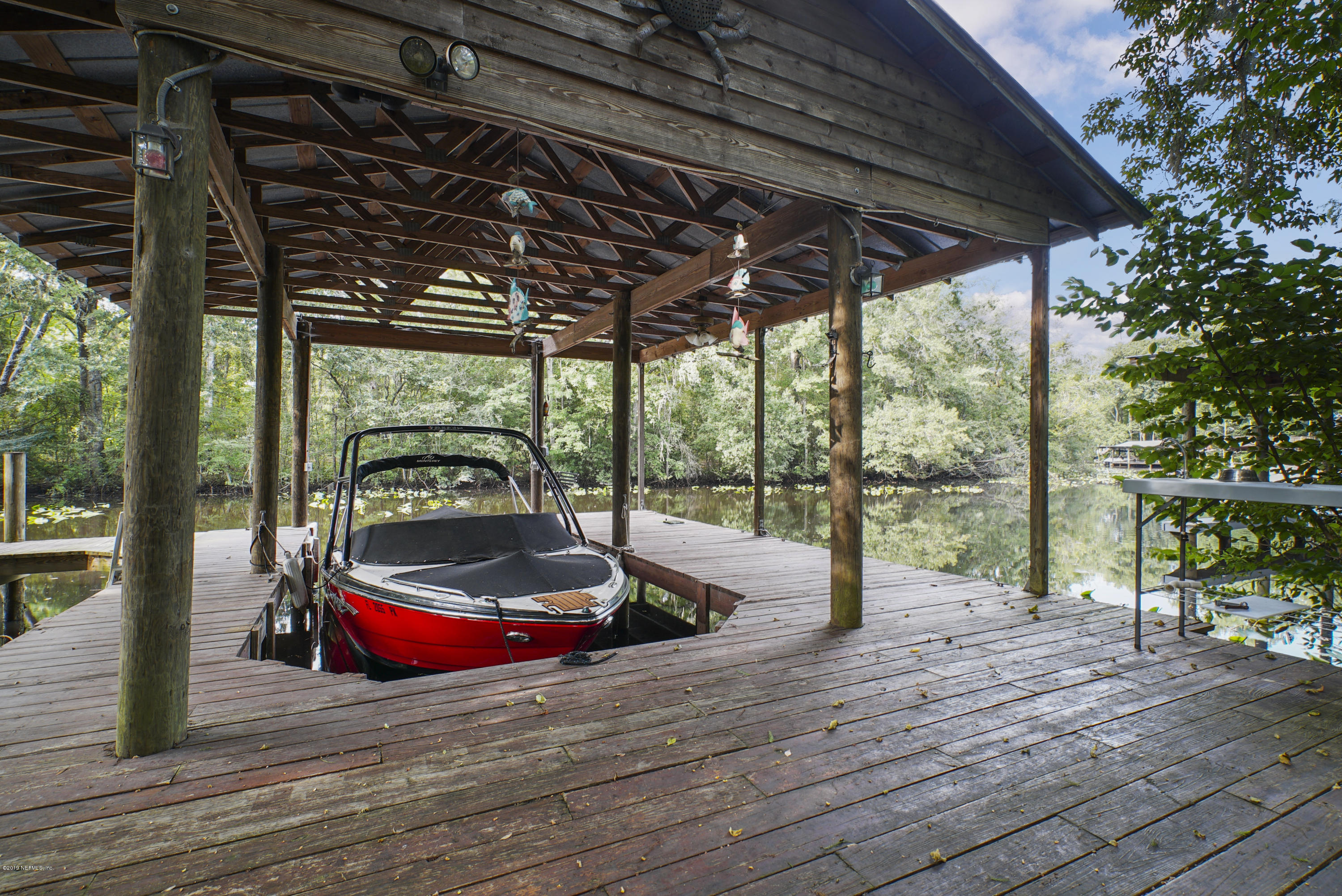 2066 Cornell Road Middleburg, FL 32068 - Photo 4 of 43 a backyard of a house with wooden floor and outdoor seating