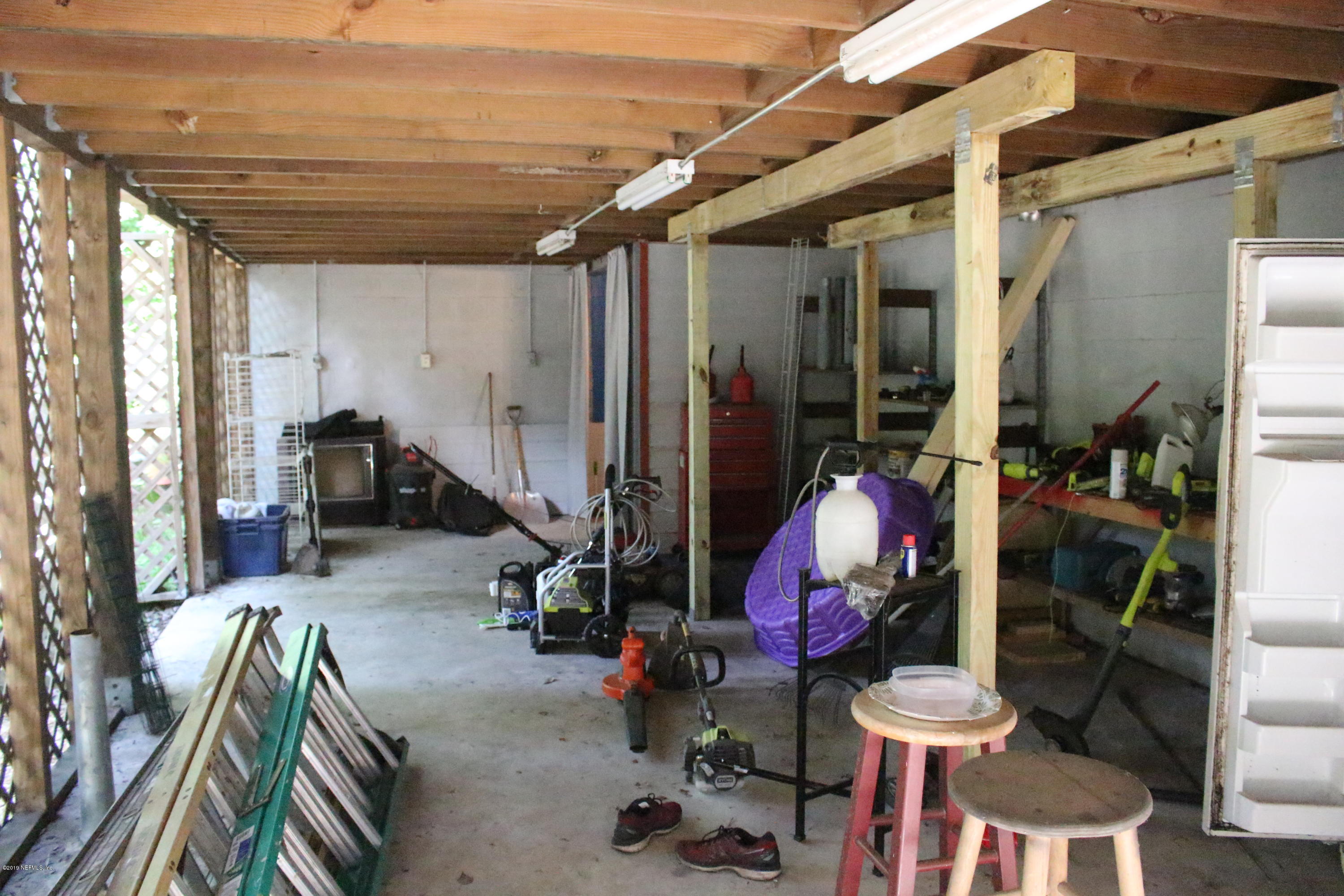 2066 Cornell Road Middleburg, FL 32068 - Photo 41 of 43 a view of a room with gym equipment