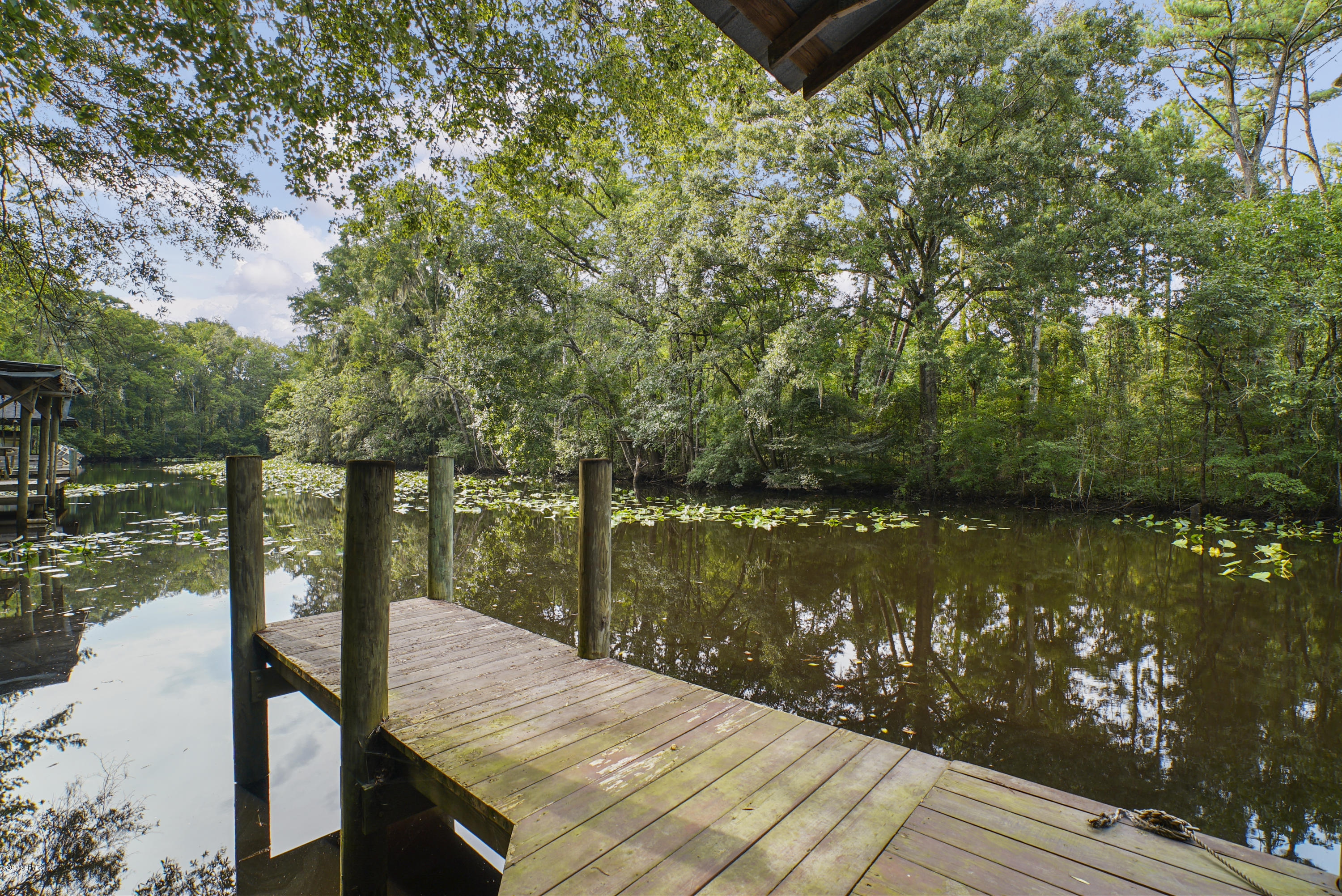 2066 Cornell Road Middleburg, FL 32068 - Photo 5 of 43 a balcony with wooden floor and lake view
