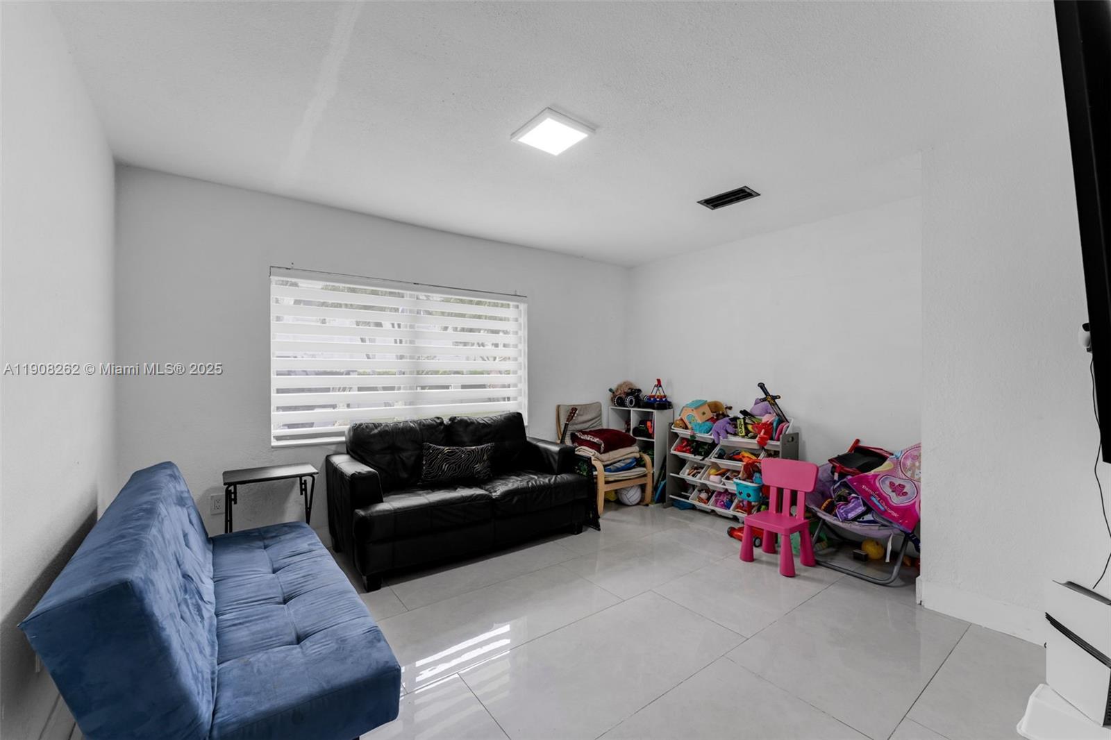 551 Southwest 127th Avenue Miami, FL 33184 - Photo 15 of 47 a living room with furniture and a window