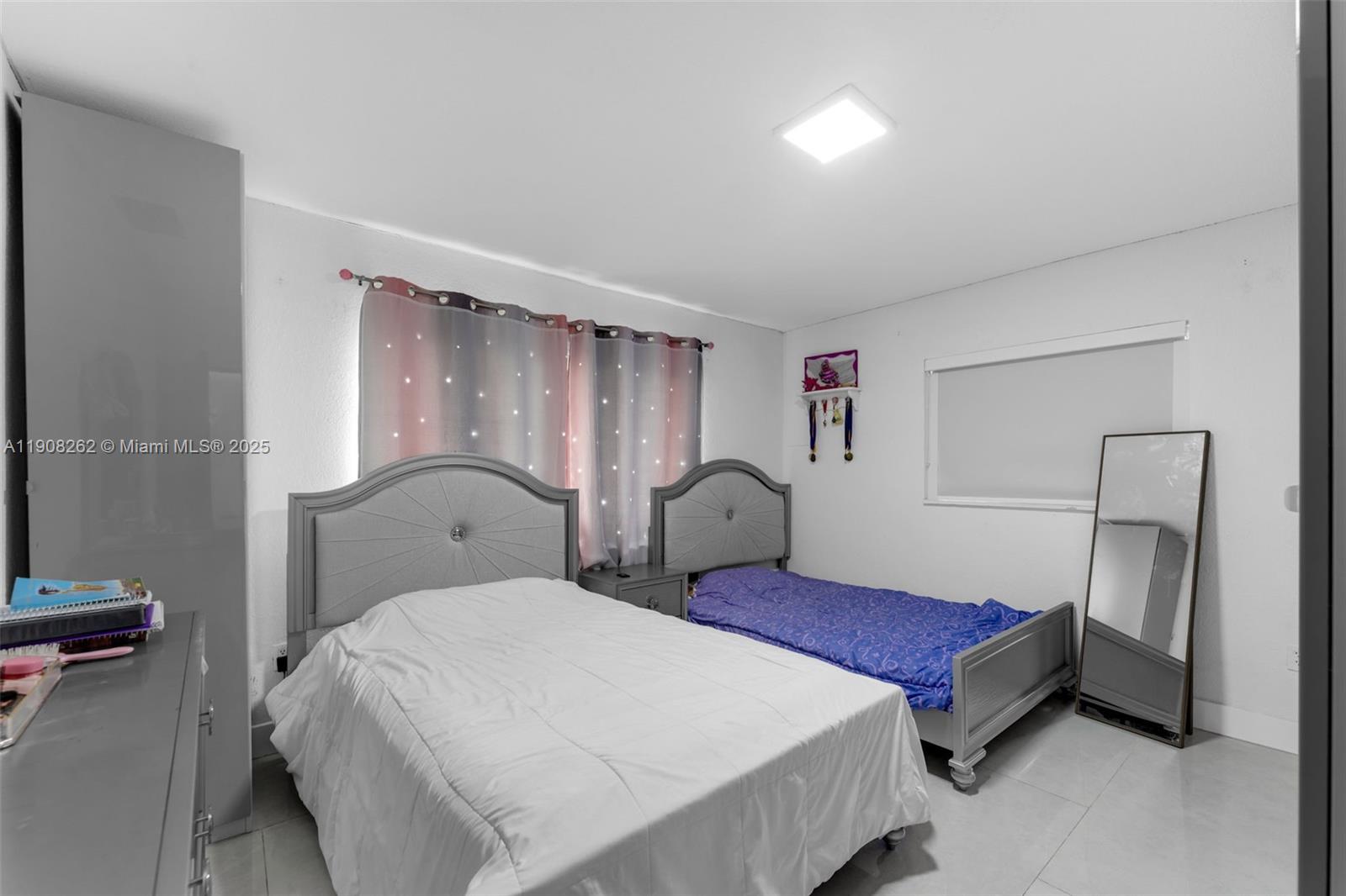 551 Southwest 127th Avenue Miami, FL 33184 - Photo 17 of 47 a bedroom with bed and wooden floor