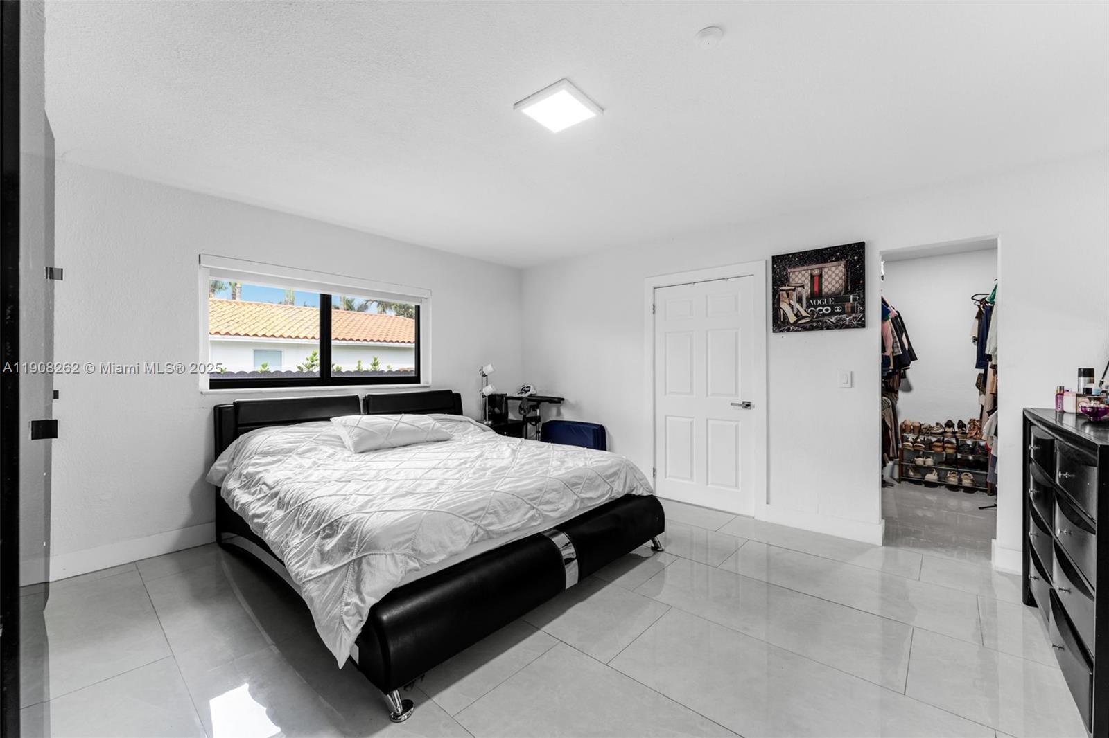 551 Southwest 127th Avenue Miami, FL 33184 - Photo 20 of 47 a bed sitting in a bedroom and a dresser