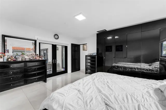 a bedroom with a bed and dresser