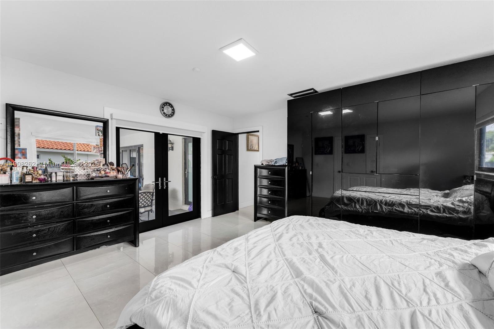 551 Southwest 127th Avenue Miami, FL 33184 - Photo 23 of 47 a bedroom with a bed and dresser