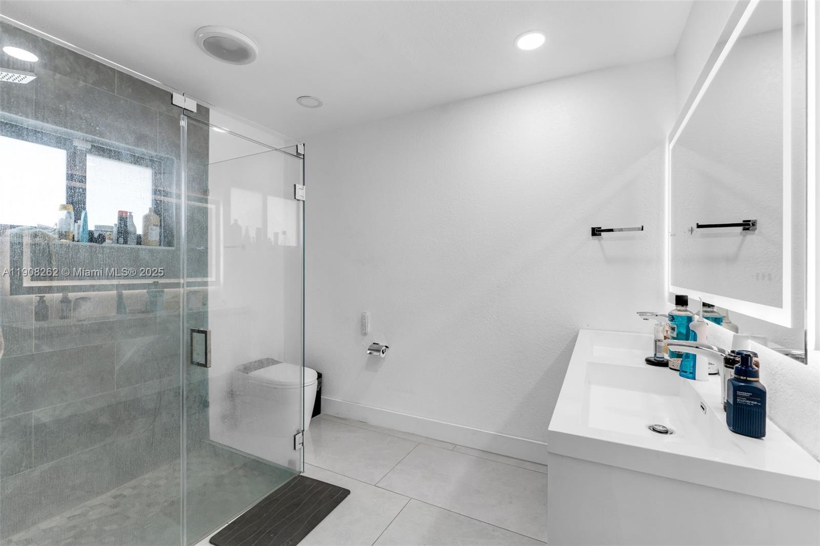 551 Southwest 127th Avenue Miami, FL 33184 - Photo 24 of 47 a bathroom with a sink and a shower