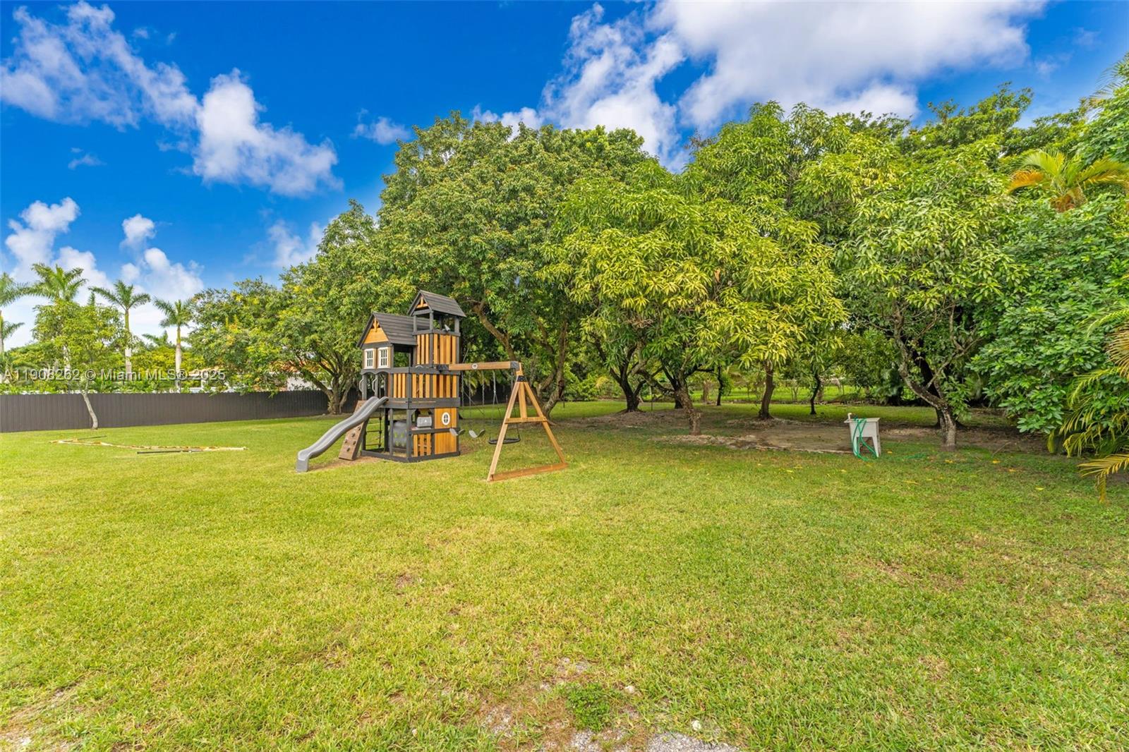 551 Southwest 127th Avenue Miami, FL 33184 - Photo 31 of 47 a view of a swimming pool with an outdoor seating and a yard