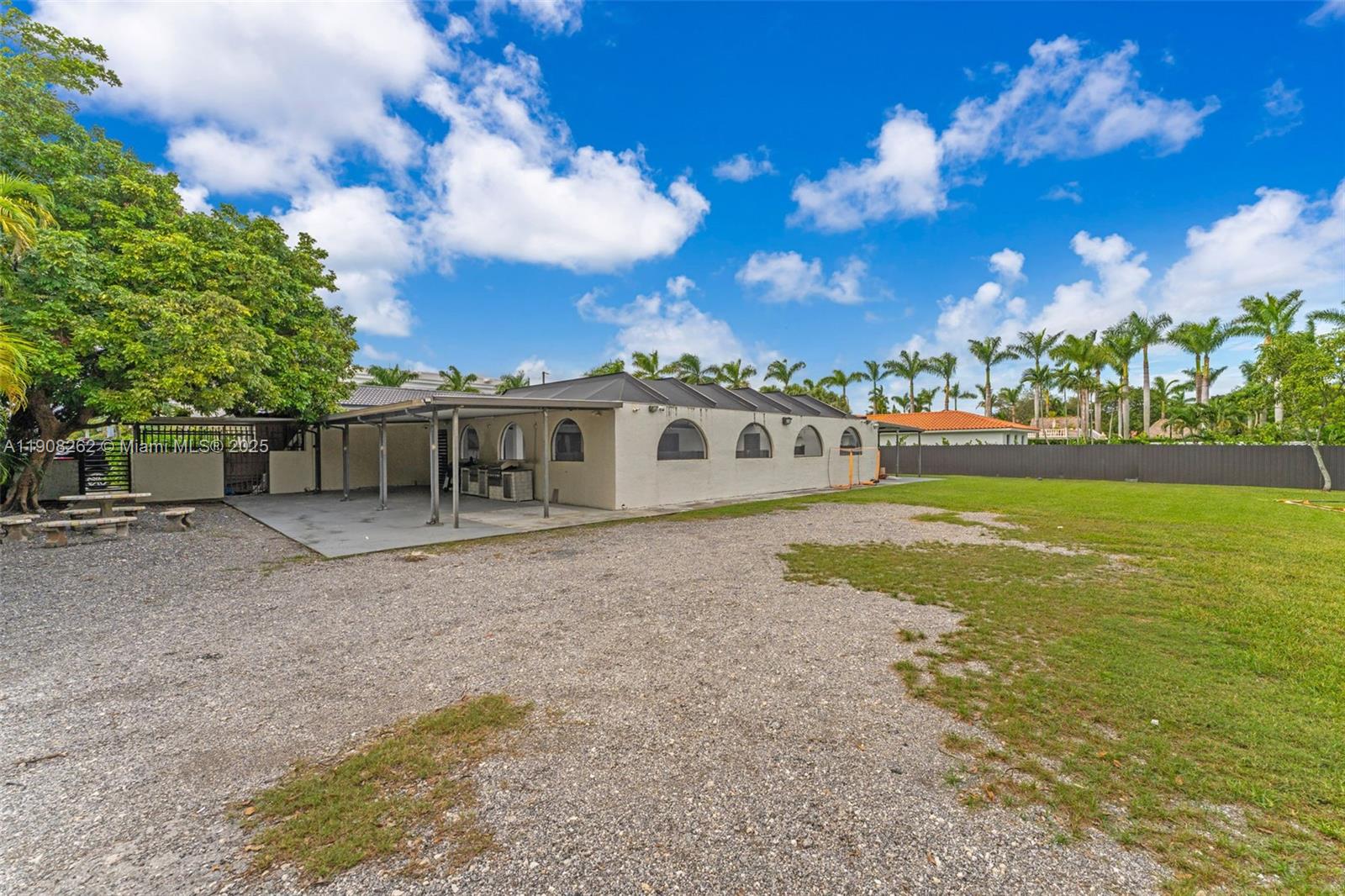 551 Southwest 127th Avenue Miami, FL 33184 - Photo 32 of 47 a front view of a house with a yard