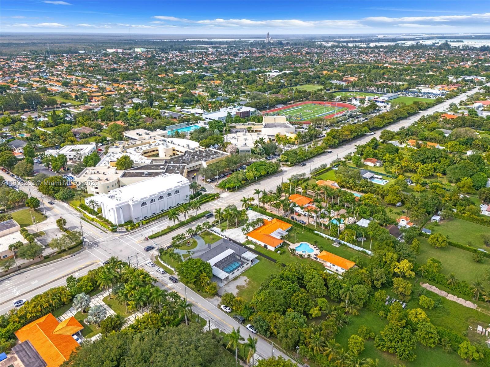 551 Southwest 127th Avenue Miami, FL 33184 - Photo 44 of 47 an aerial view of residential houses with outdoor space and trees