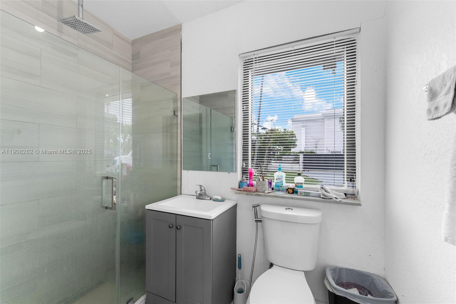 551 Southwest 127th Avenue Miami, FL 33184 - Photo 10 of 47 a bathroom with a sink toilet and shower