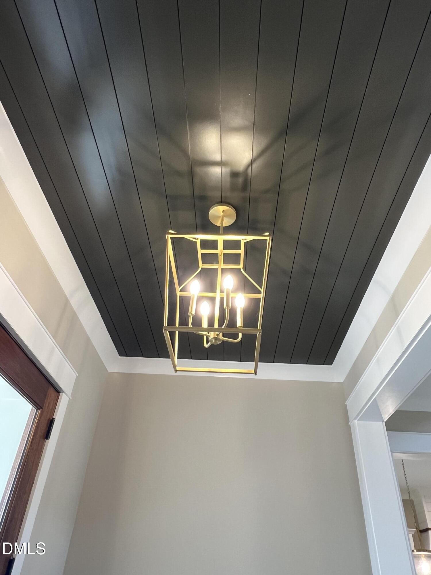 2560 Lassiter Road Four Oaks, NC 27524 - Photo 13 of 66 a view of an empty room with a fireplace and a window