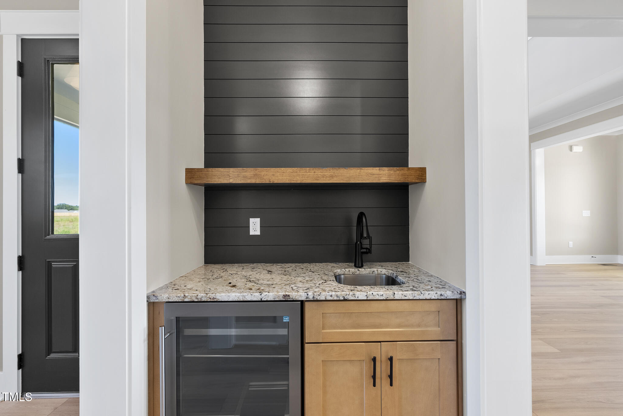 2560 Lassiter Road Four Oaks, NC 27524 - Photo 23 of 66 a bathroom with a granite countertop sink and white cabinets