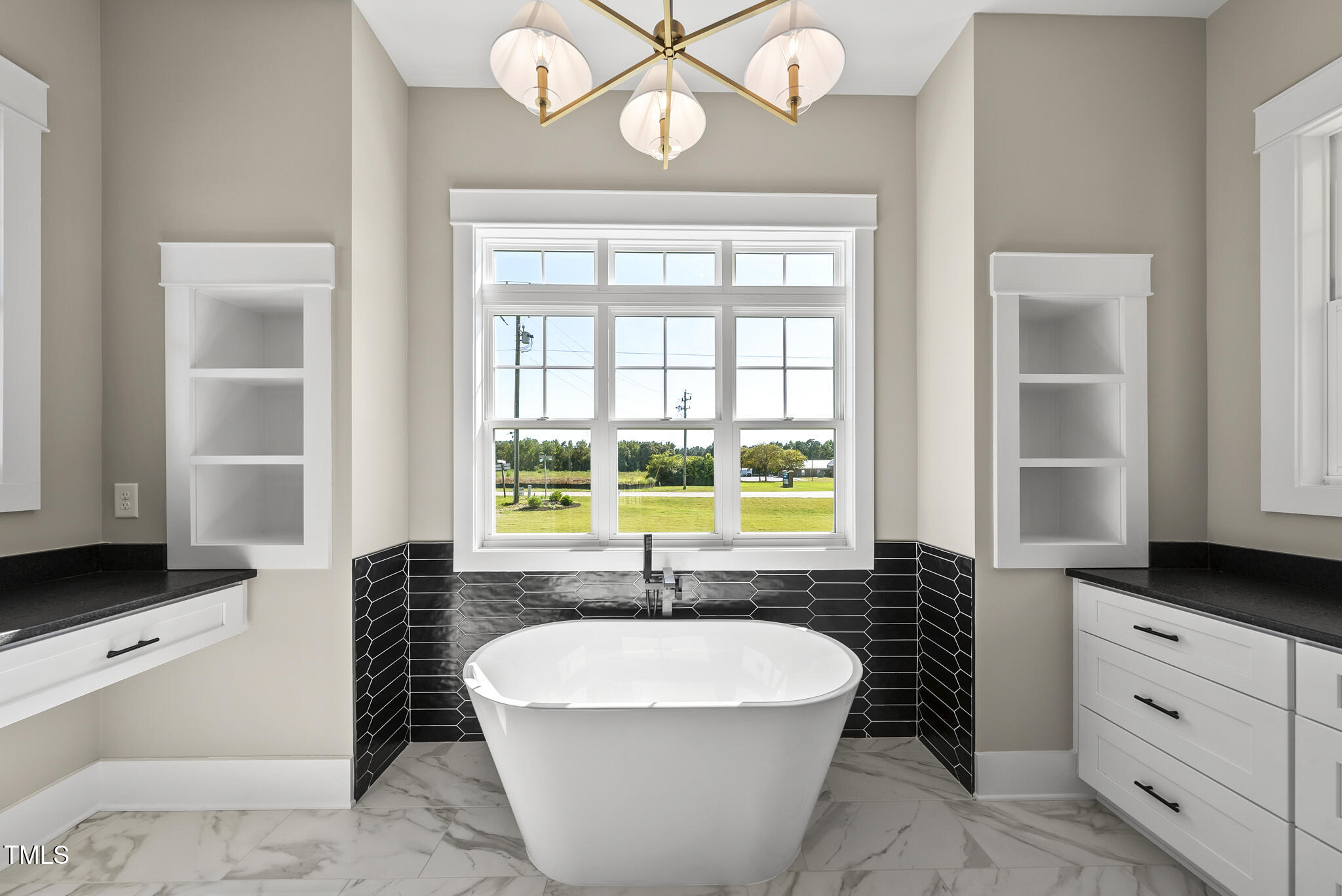 2560 Lassiter Road Four Oaks, NC 27524 - Photo 36 of 66 a living room with furniture a large window and a chandelier