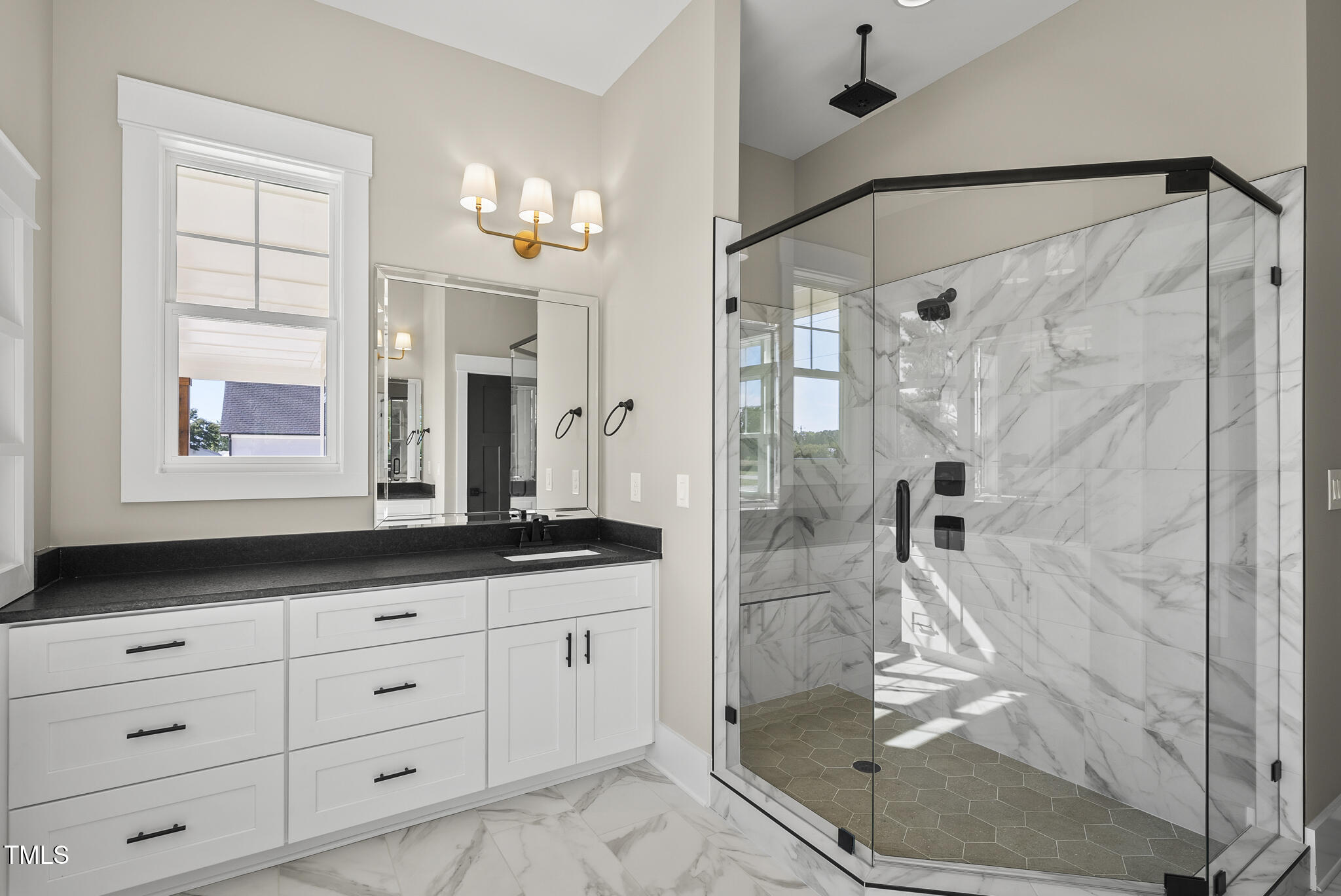 2560 Lassiter Road Four Oaks, NC 27524 - Photo 38 of 66 a spacious bathroom with a granite countertop sink a mirror a shower and a bathtub