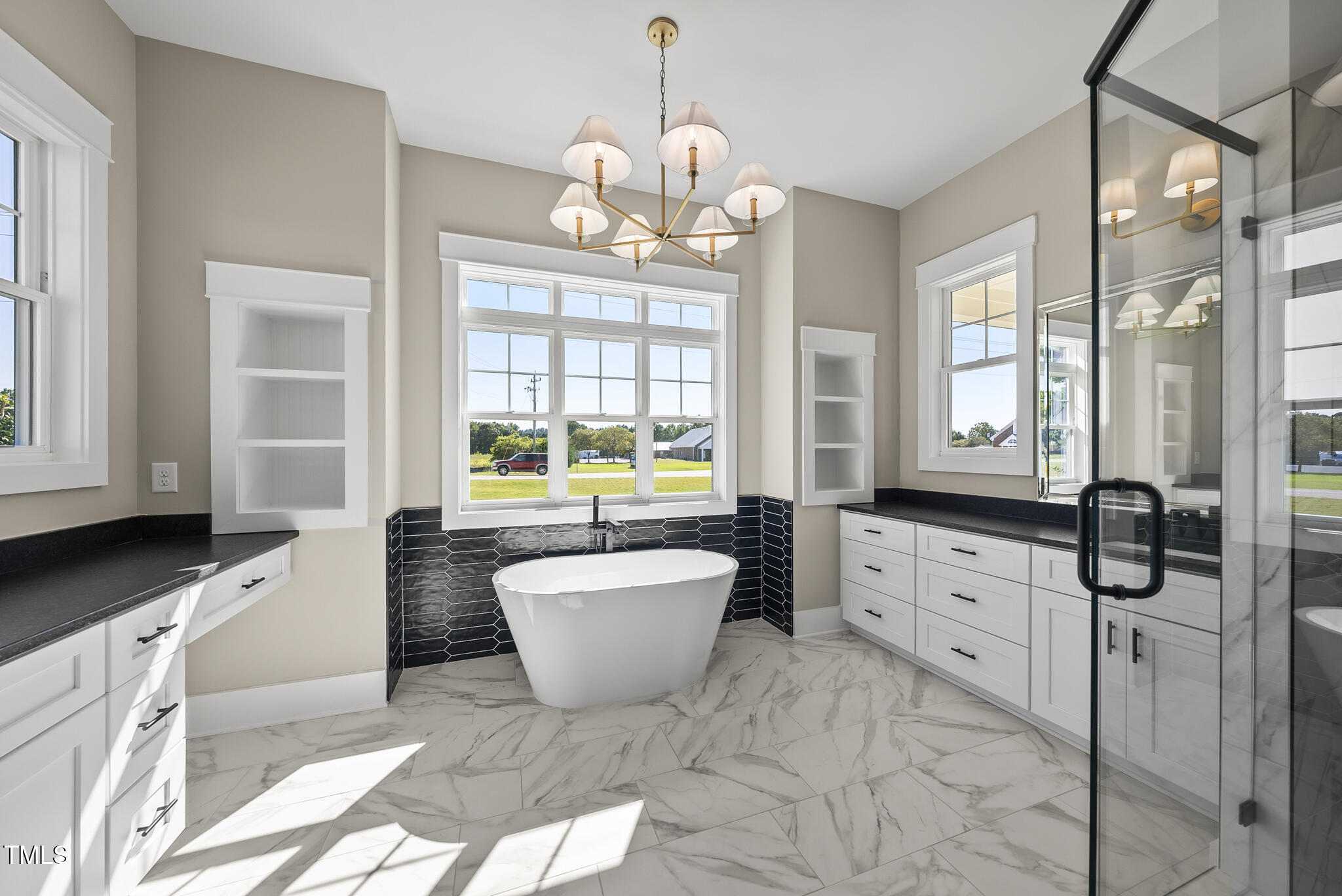 2560 Lassiter Road Four Oaks, NC 27524 - Photo 39 of 66 a spacious bathroom with a granite countertop tub sink and mirror