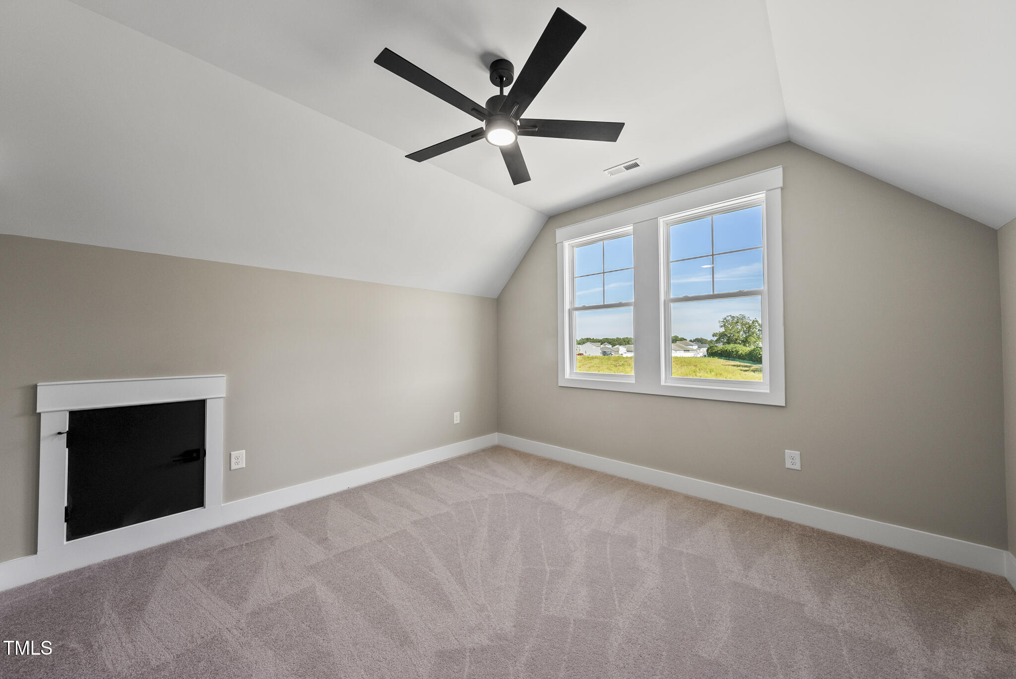 2560 Lassiter Road Four Oaks, NC 27524 - Photo 48 of 66 an empty room with window and ceiling fan