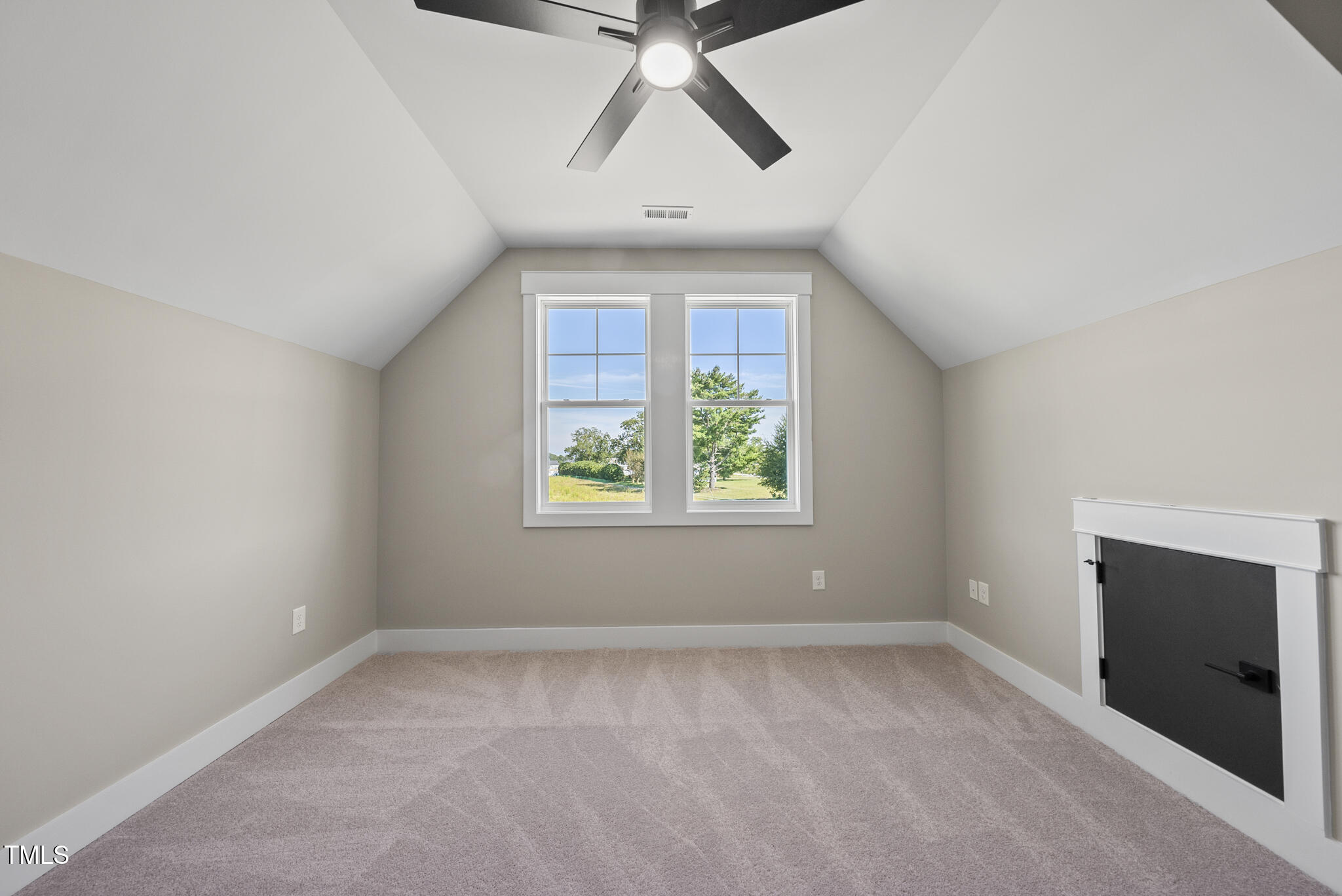 2560 Lassiter Road Four Oaks, NC 27524 - Photo 49 of 66 an empty room with windows and ceiling fan