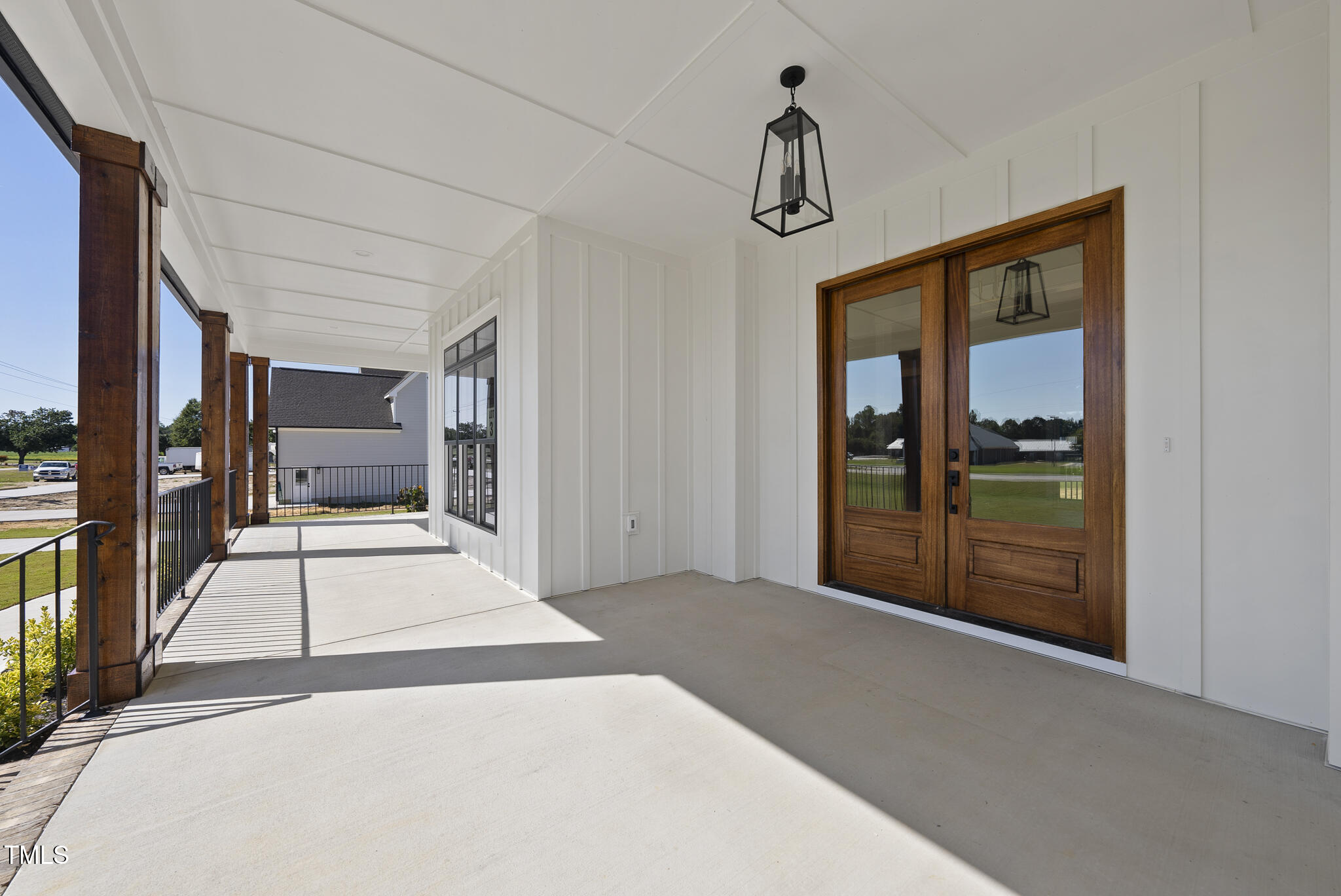 2560 Lassiter Road Four Oaks, NC 27524 - Photo 8 of 66 a view of a hallway with a chandelier