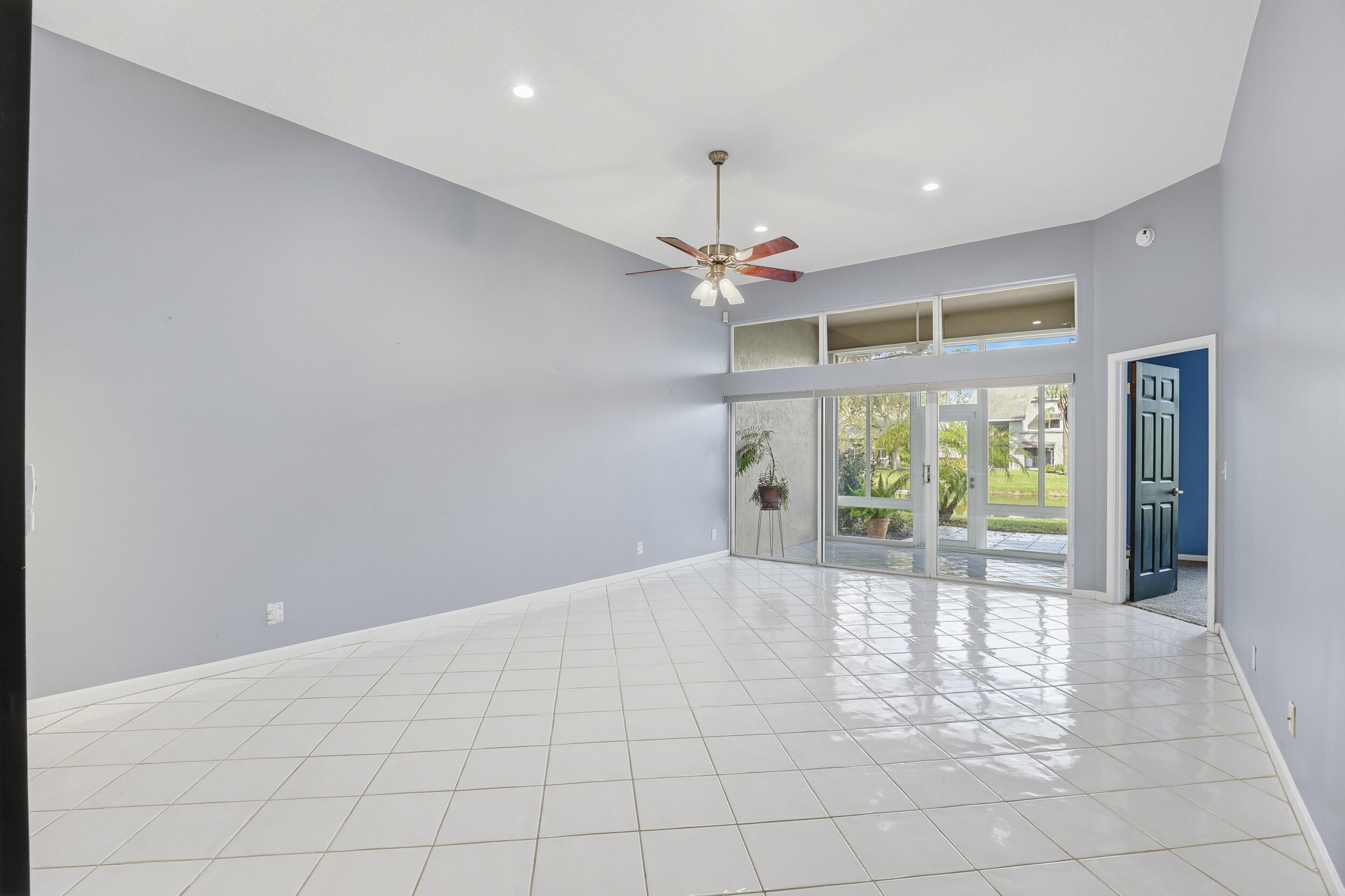 5405 Monterey Circle, Unit G Delray Beach, FL 33484 - Photo 31 of 72 a view of a livingroom with a ceiling fan and window