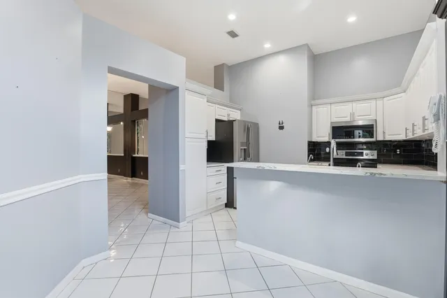a view of a livingroom with a ceiling fan and window
