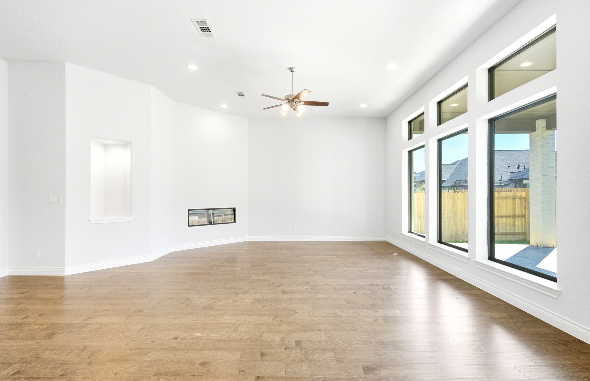 38642 Night Brood Court Magnolia, TX 77354 - Photo 12 of 32 wooden floor in an empty room with a window