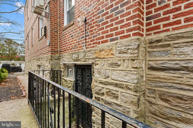 a view of a balcony with wooden floor and fence