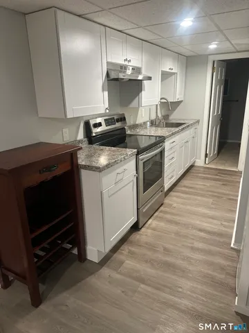 a kitchen with a stove and a microwave