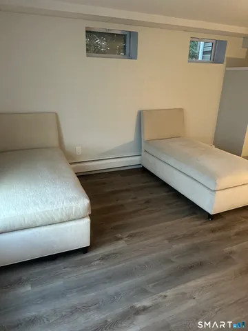 a bedroom with a bed and a night stand