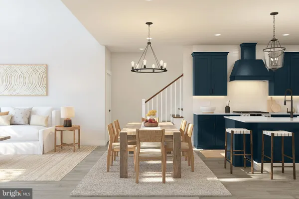 a dining room with furniture a chandelier and wooden floor