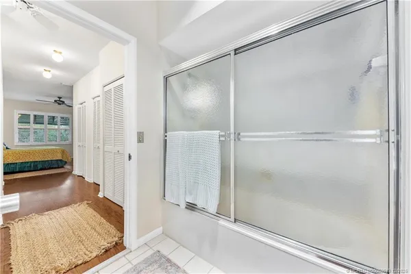 a walk in closet with a rug