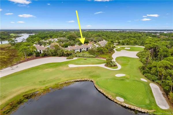 a view of an swimming pool with a yard
