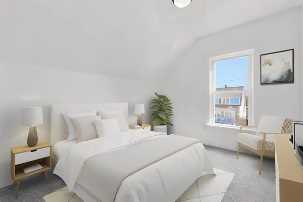 a bedroom with a bed and a window
