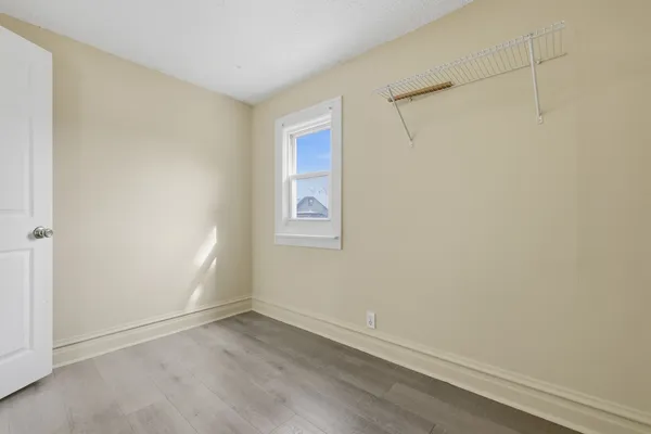 an empty room with a empty space and a window