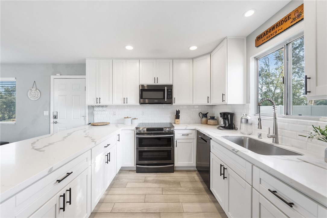 35825 Meadow Ridge Road Temecula, CA 92592 - Photo 36 of 75 a kitchen with cabinets stainless steel appliances a sink and a window