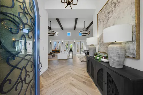 a living room with furniture a ceiling fan and a rug