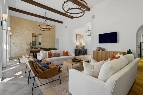 a view of living room with furniture and window
