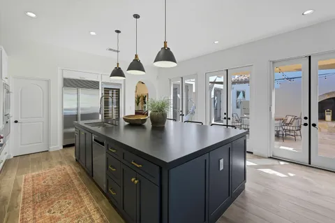 a kitchen with granite countertop stainless steel appliances and cabinets