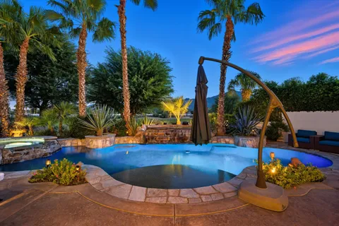 a view of a swimming pool with a patio